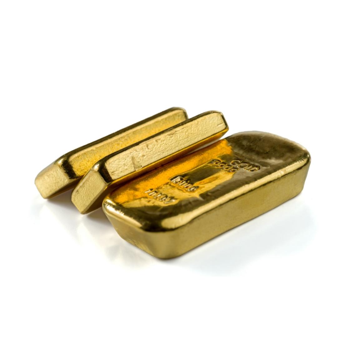 drei Goldbarren liegend 